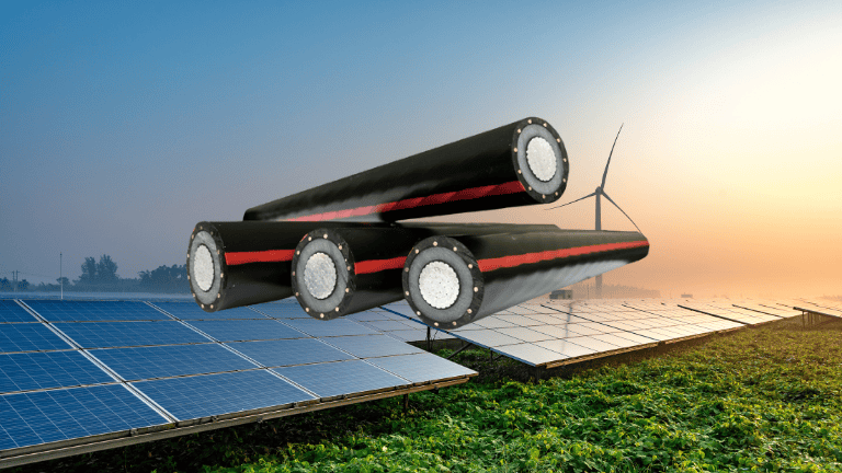 Composite image of three large MV cables over solar panels and a wind turbine in a green field, intertwined with medium voltage cables, symbolizing renewable energy storage.